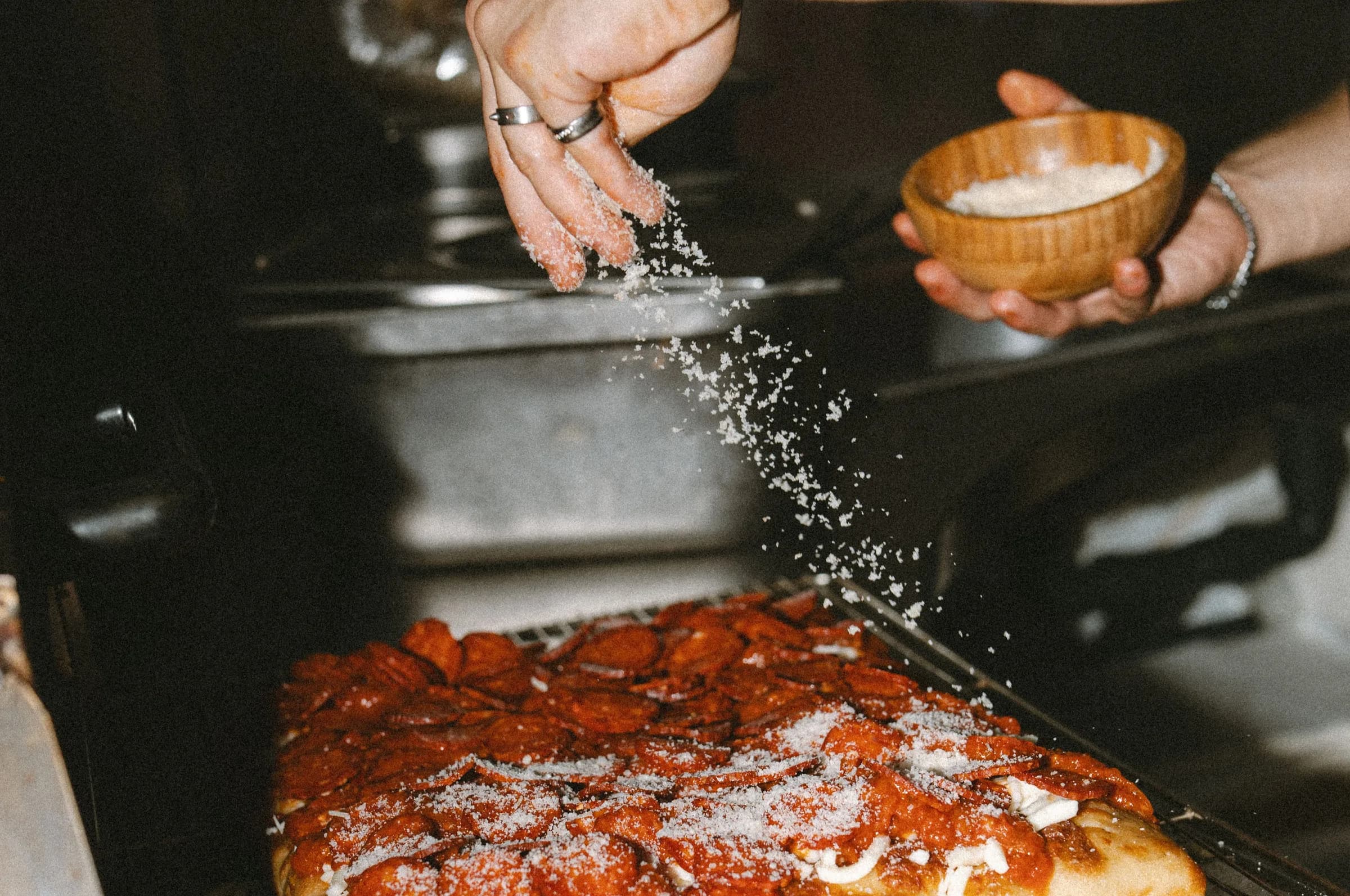 Fresh Detroit Style Pizza coming out of the oven at Pizza Yolo